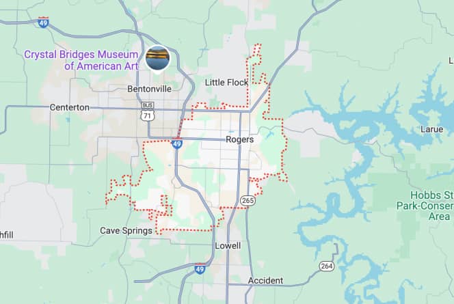 Map showing Rogers, Arkansas area with major roads and landmarks, including Crystal Bridges Museum of American Art and nearby towns like Bentonville and Cave Springs.